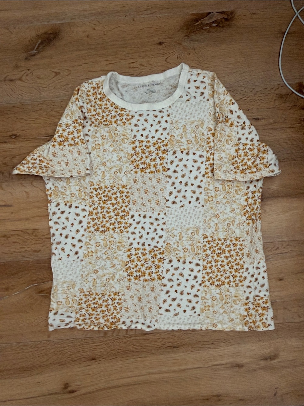 American Eagle Cream Tee with Gold Paisley Print